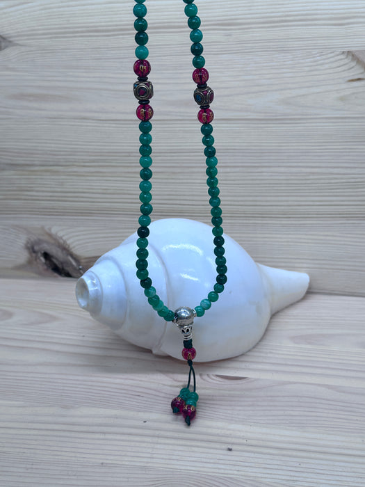 108-bead jade mala with red agate beads inscribed Om Mani Padme Hum
