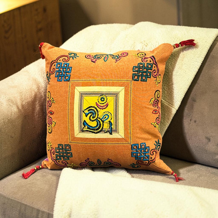Cushion with embroidered om