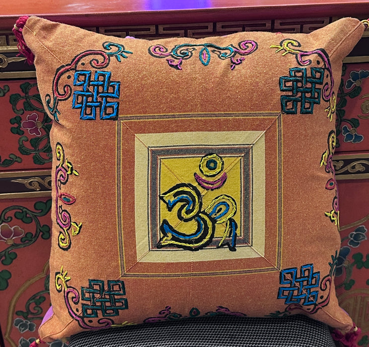 Cushion with embroidered om