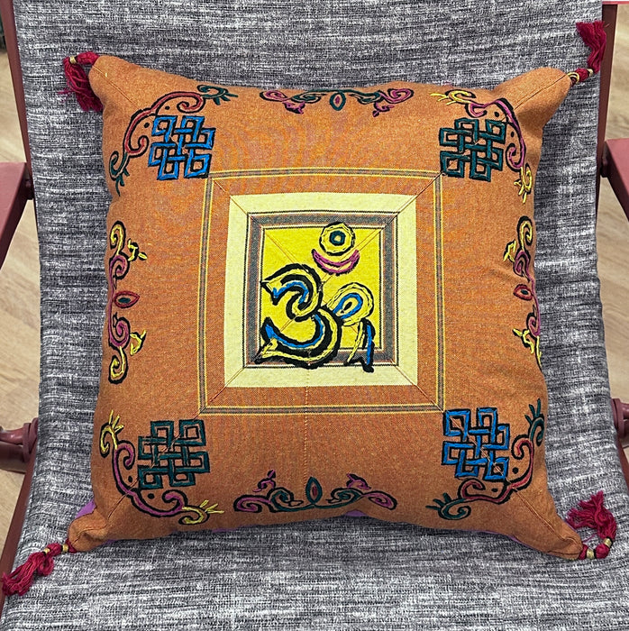 Cushion with embroidered om