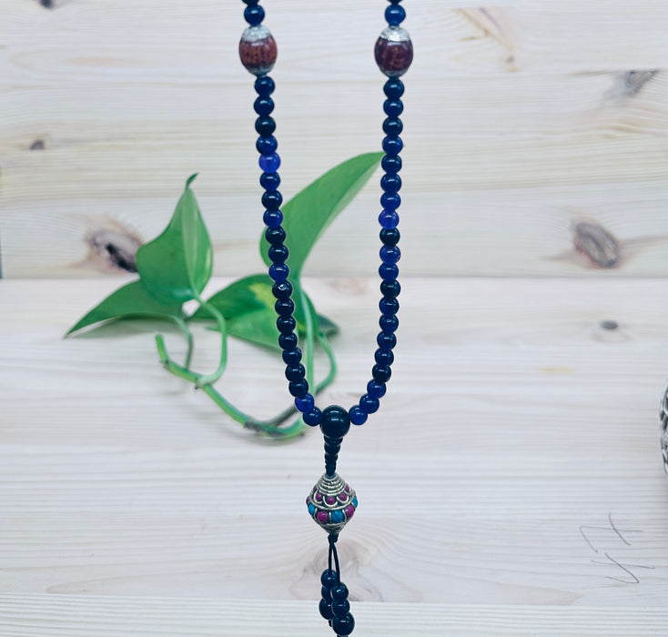 108-bead Amethyst mala with a beautiful, intricately carved bead