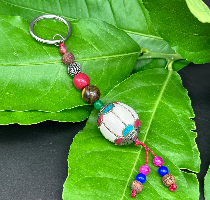 Porta chiavi tibetano con fiori di lotto