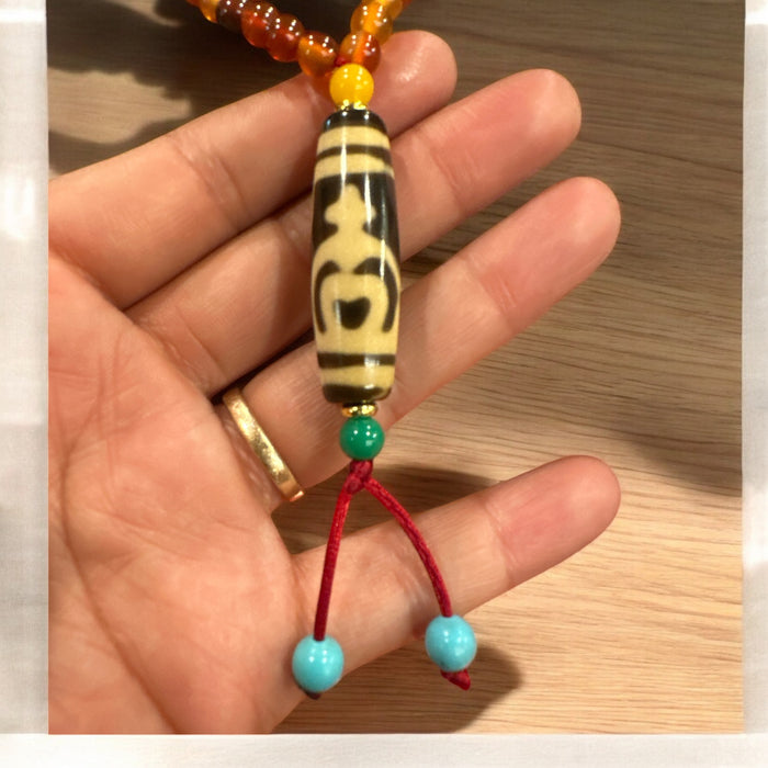 Dzi tibetano con vaso di fortuna