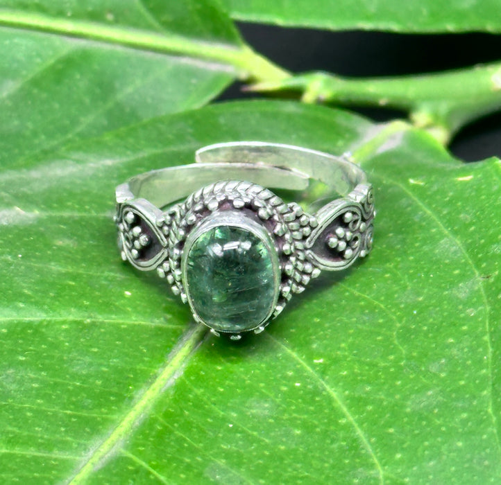 Tibetan ring with iridescent green Opal