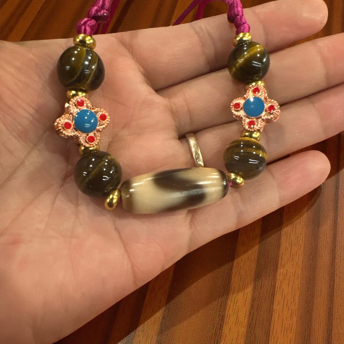 Dzi Tibetana a dente di Lione con Occhio di Tigre