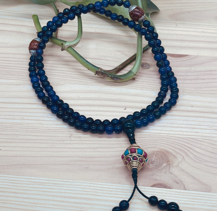 108-bead Amethyst mala with a beautiful, intricately carved bead