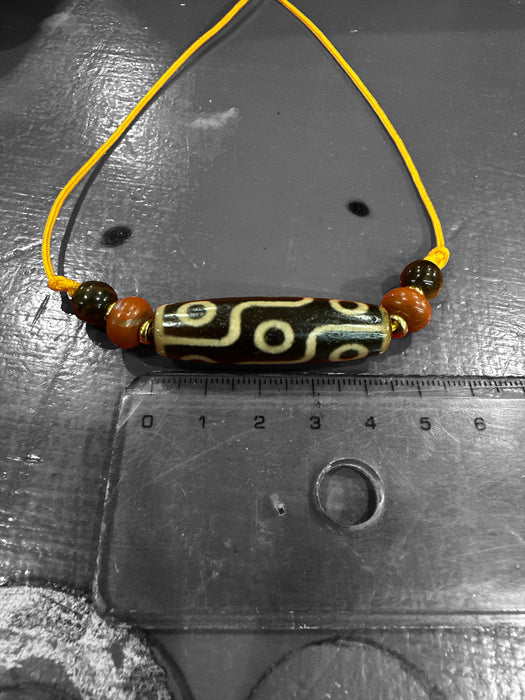 Dzi tibetano con 9 occhi