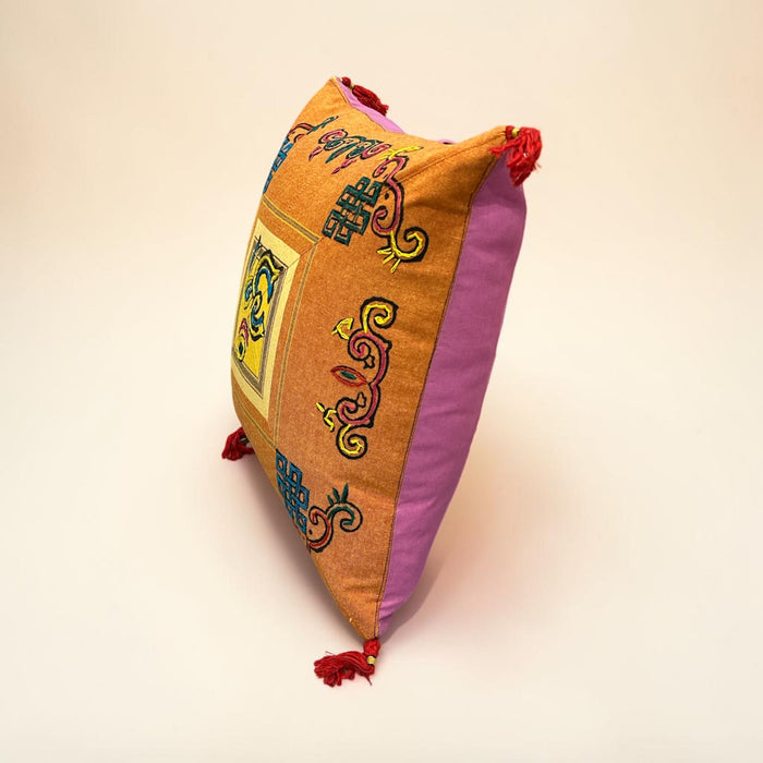 Cushion with embroidered om