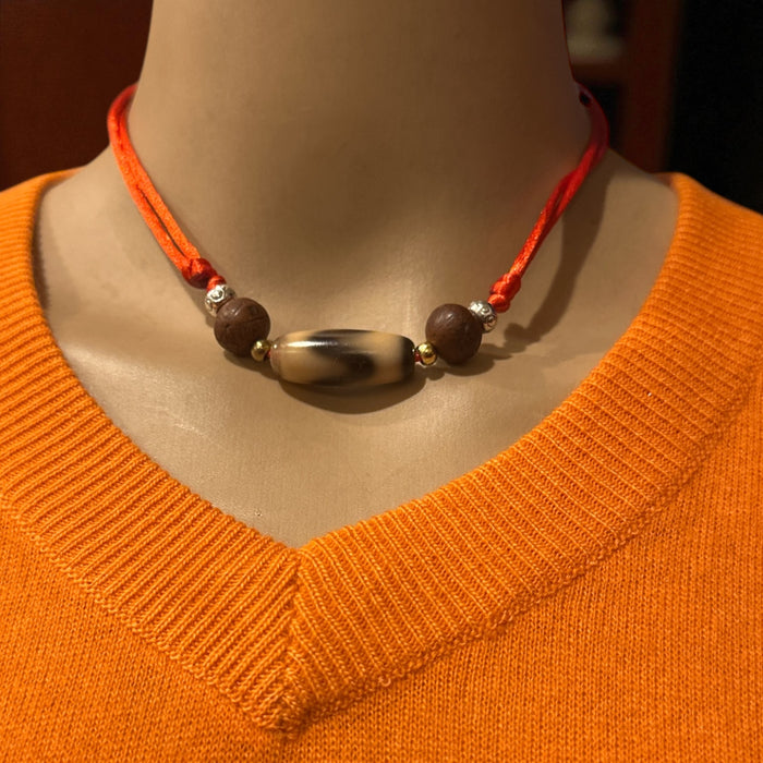 Dzi tibetano a disegno  dente di lione con semi di Bodhichita