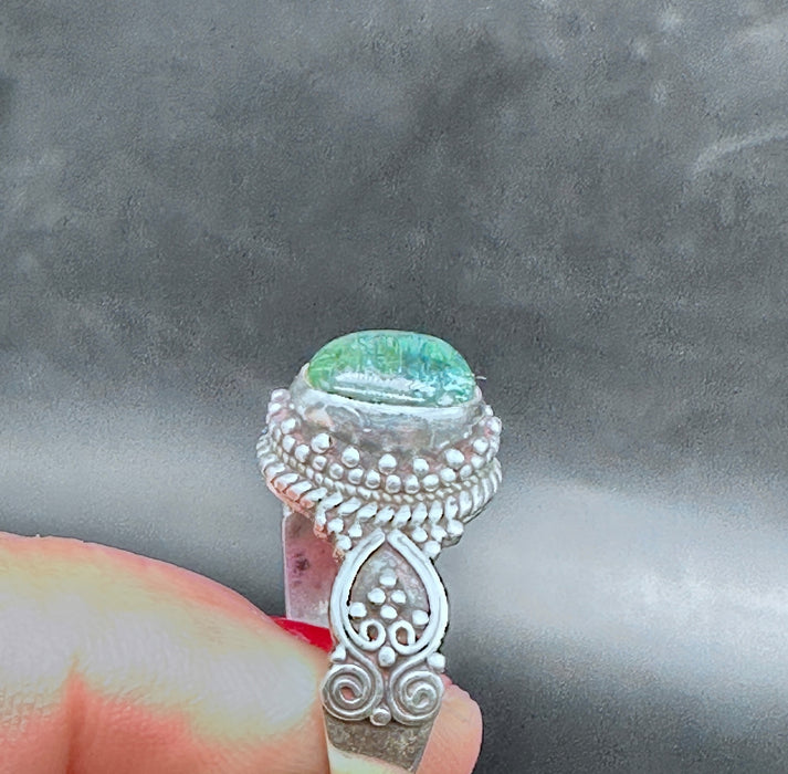 Tibetan ring with iridescent green Opal