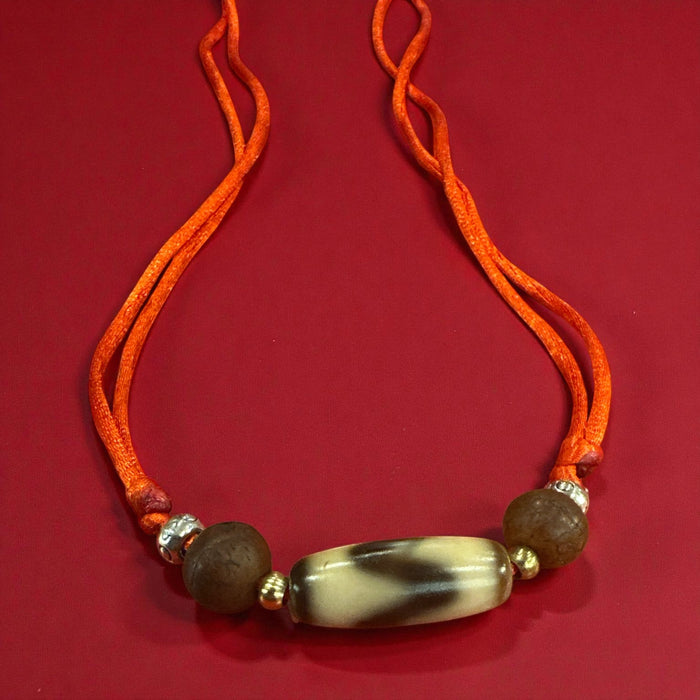 Dzi tibetano a disegno  dente di lione con semi di Bodhichita