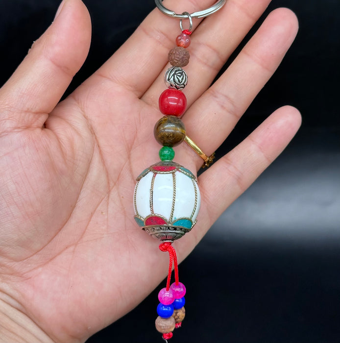 Porta chiavi tibetano con fiori di lotto