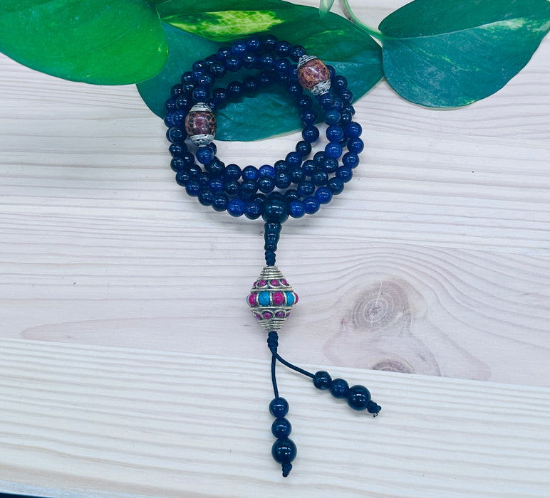 108-bead Amethyst mala with a beautiful, intricately carved bead