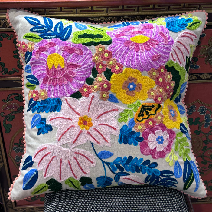 Embroidered flower cushion