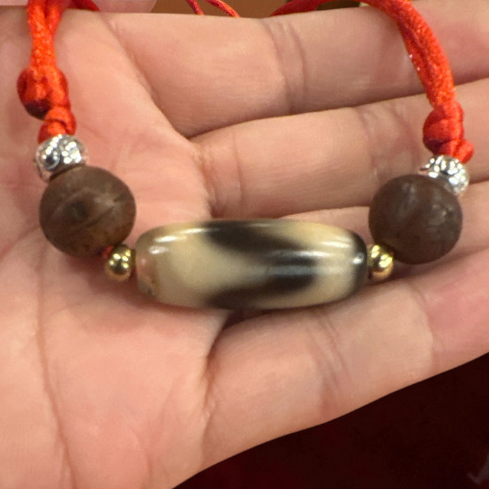 Dzi tibetano a disegno  dente di lione con semi di Bodhichita