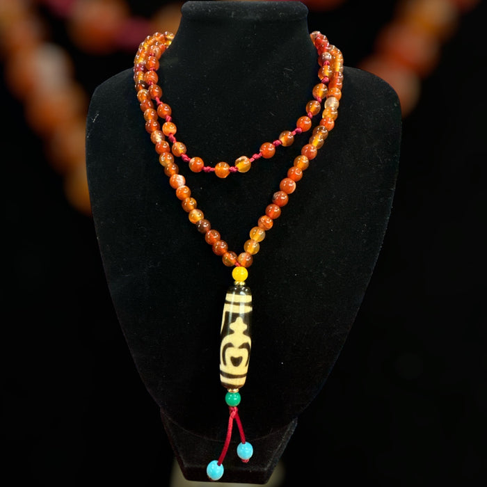 Dzi tibetano con vaso di fortuna