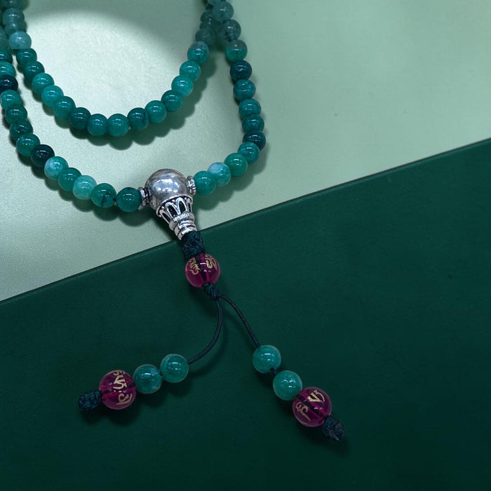 108-bead jade mala with red agate beads inscribed Om Mani Padme Hum