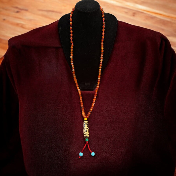 Dzi tibetano con vaso di fortuna