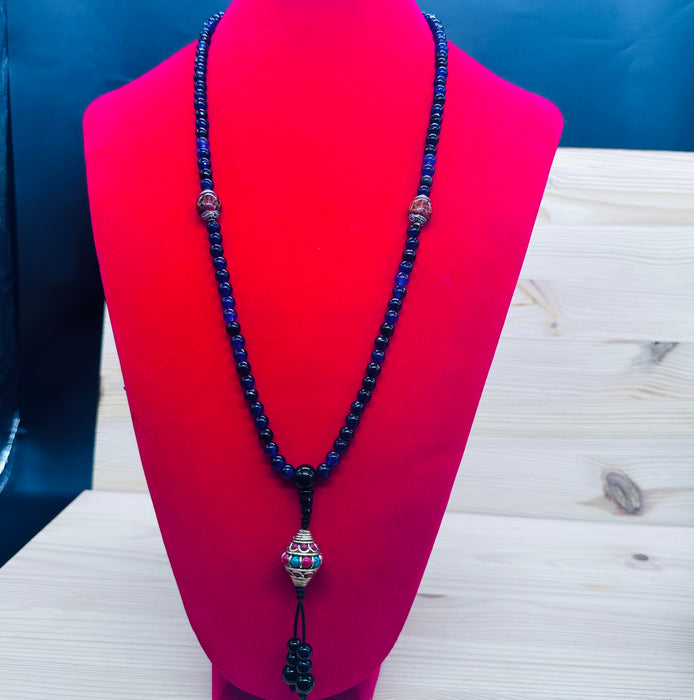 108-bead Amethyst mala with a beautiful, intricately carved bead
