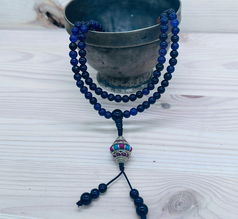 108-bead Amethyst mala with a beautiful, intricately carved bead