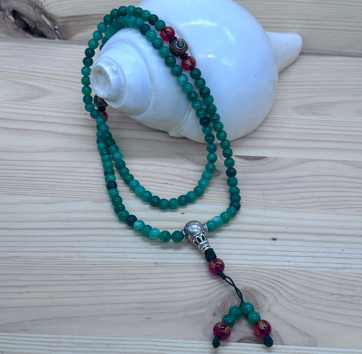 108-bead jade mala with red agate beads inscribed Om Mani Padme Hum