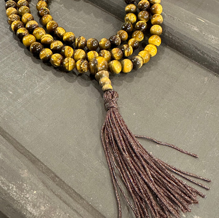 Mala occhio di tigre con 7 chakra e nappa