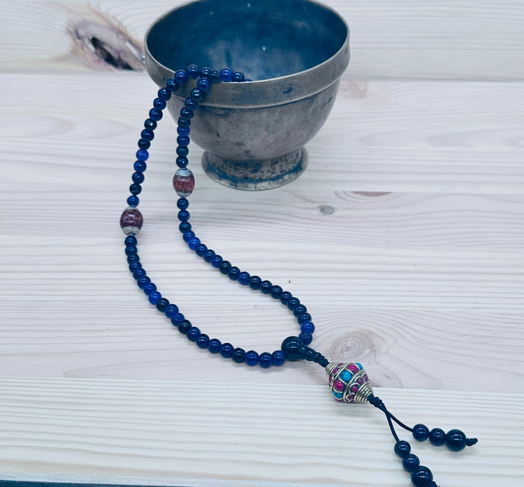 108-bead Amethyst mala with a beautiful, intricately carved bead