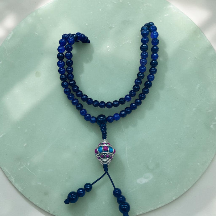 108-bead Amethyst mala with a beautiful, intricately carved bead