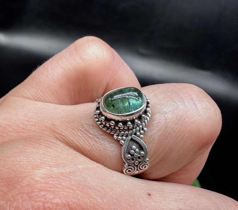 Tibetan ring with iridescent green Opal