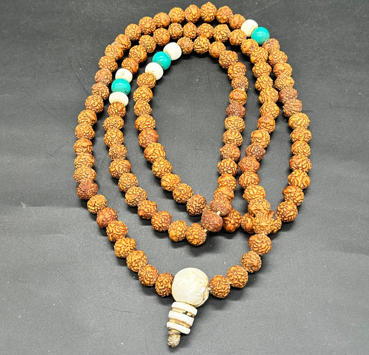 Mala con turchese e conchiglia