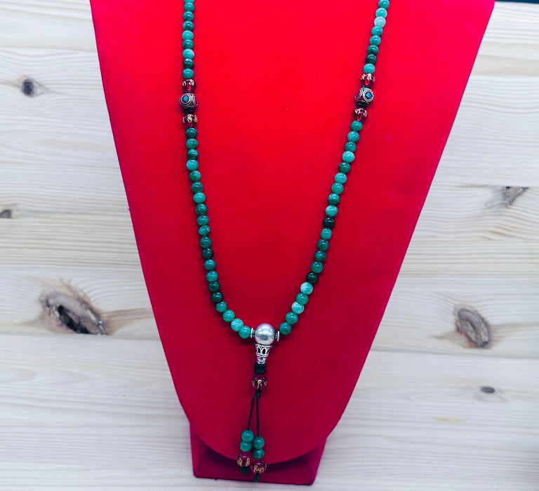 108-bead jade mala with red agate beads inscribed Om Mani Padme Hum
