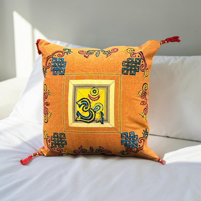Cushion with embroidered om