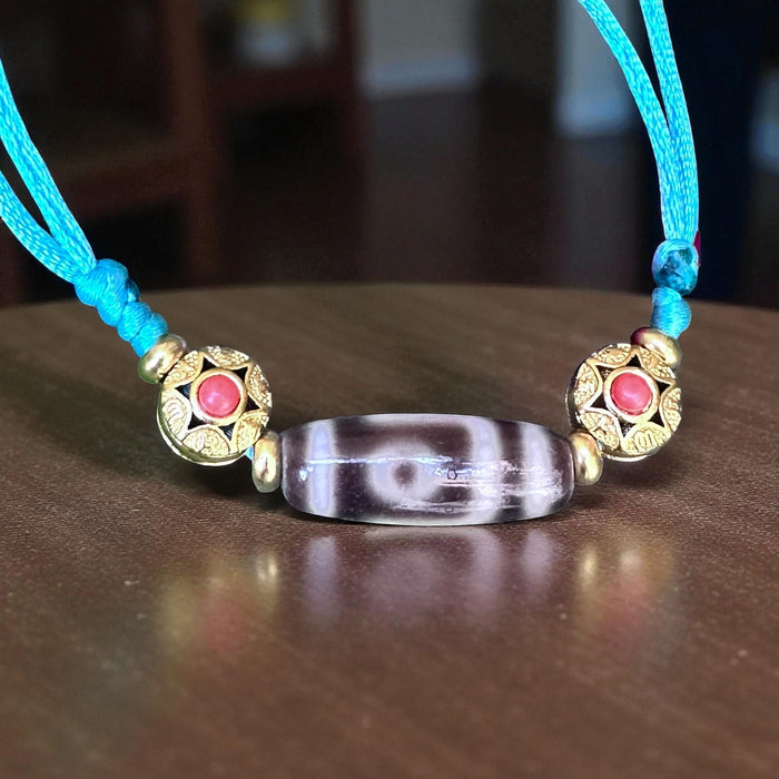 Dzi tibetano a 2 Occhi e Grani di Mandala