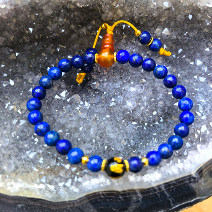 Lapis lazuli bracelet with Om mani padme hum on Black Tourmaline