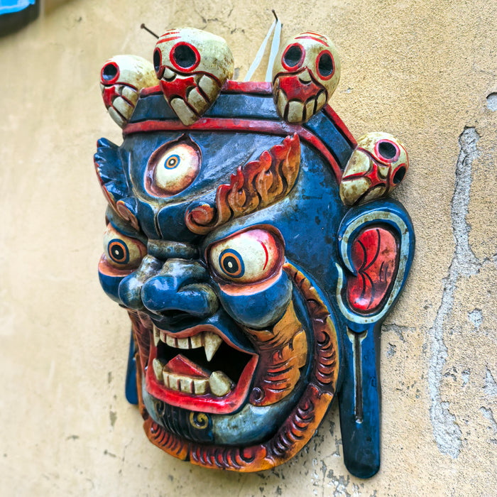 Maschera di Mahākāla blu in legno