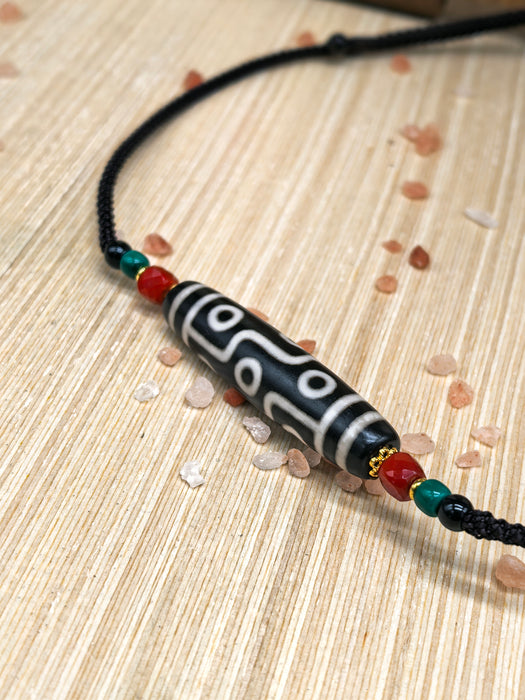 Dzi tibetano a nove occhi